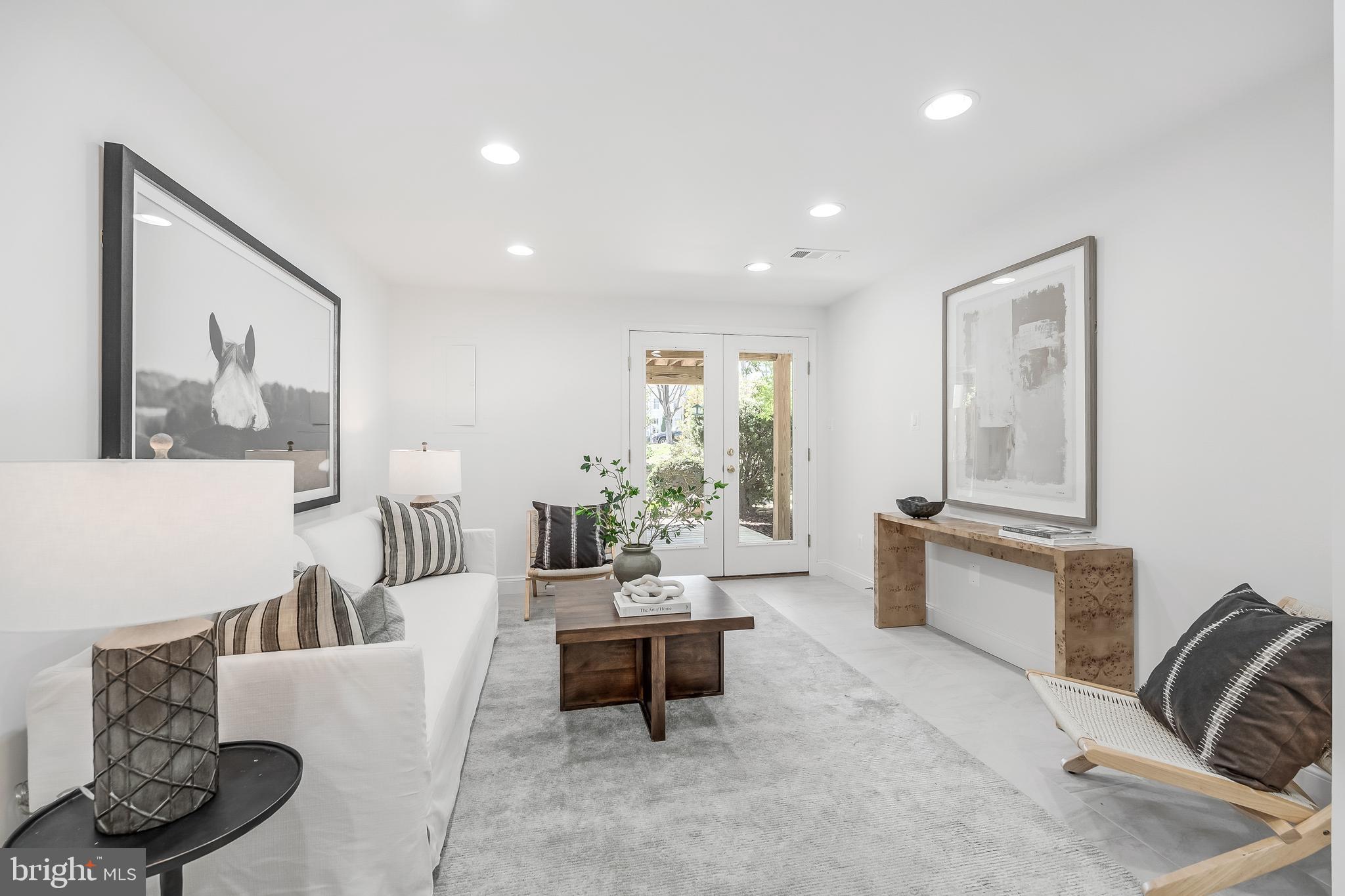 11257 Silentwood Lane Reston, VA 20191 - Photo 37 of 44 a living room with furniture and a large window