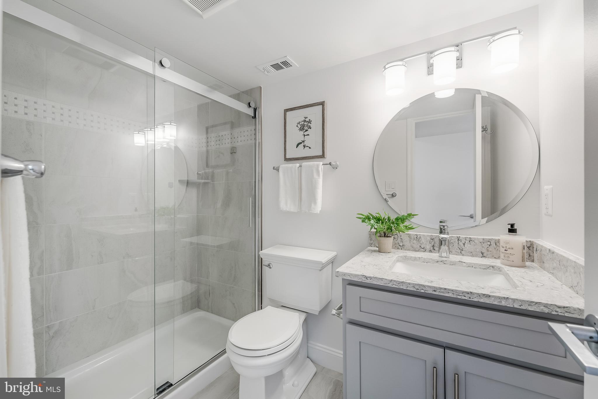 11257 Silentwood Lane Reston, VA 20191 - Photo 38 of 44 a bathroom with a sink toilet and shower