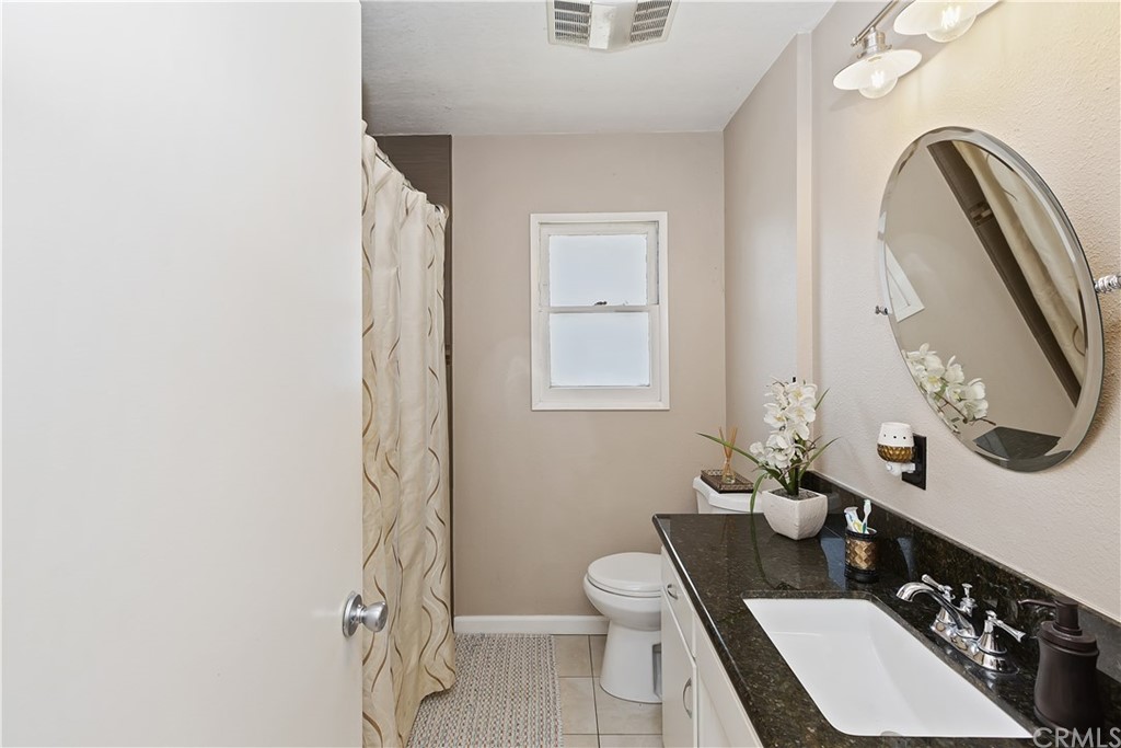 3451 Mono Drive Riverside, CA 92506 - Photo 16 of 24 a bathroom with a sink toilet and shower