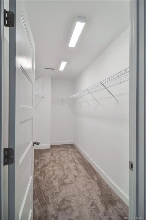 1338 Armstrong Road Belmont, NC 28012 - Photo 11 of 14 an empty room with white walls and fan