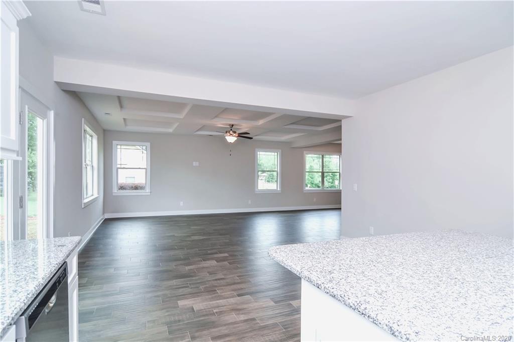 1338 Armstrong Road Belmont, NC 28012 - Photo 5 of 14 wooden floor in an empty room with a window
