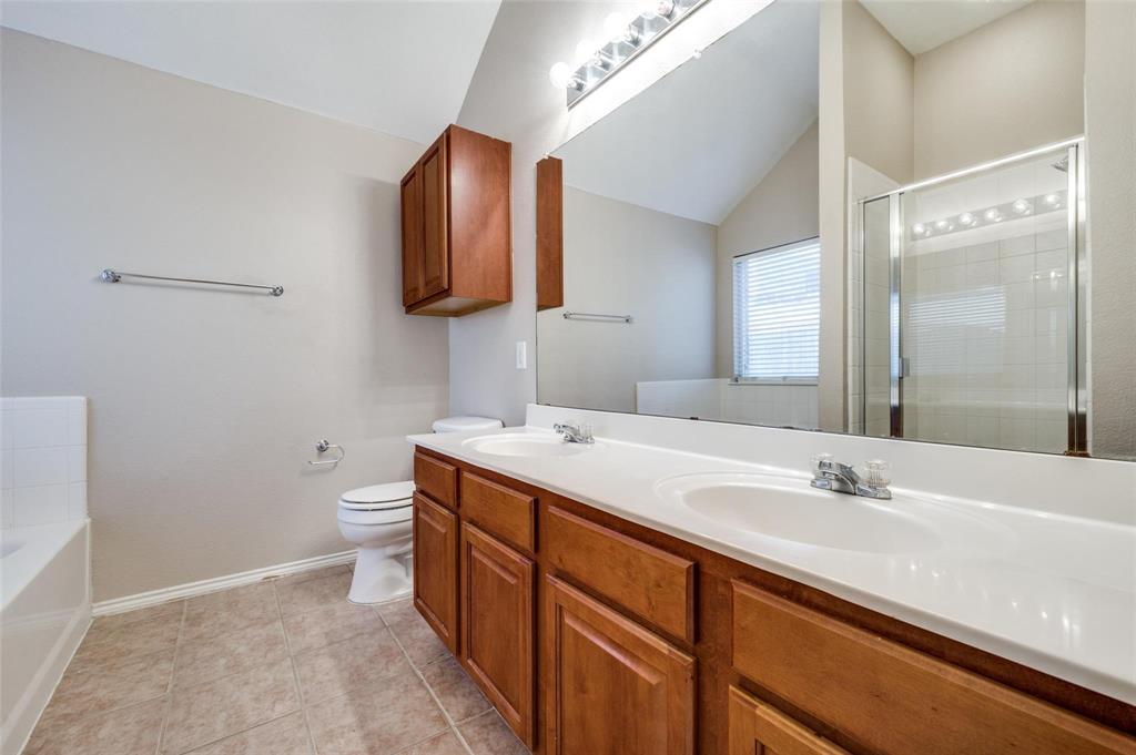 6752 Longhorn Trail Frisco, TX 75034 - Photo 11 of 12 a bathroom with a sink and a mirror