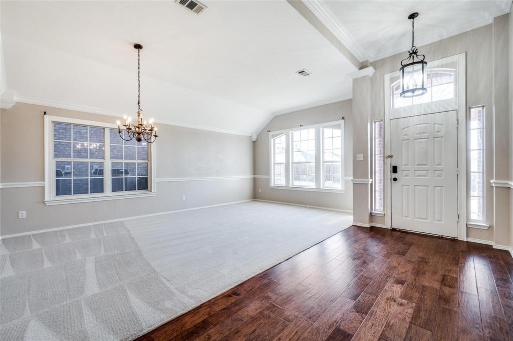 6752 Longhorn Trail Frisco, TX 75034 - Photo 3 of 12 a view of an empty room with wooden floor and a window