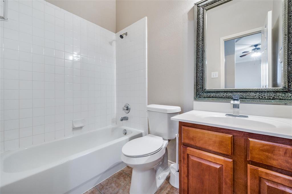 6752 Longhorn Trail Frisco, TX 75034 - Photo 9 of 12 a bathroom with a sink toilet vanity and shower