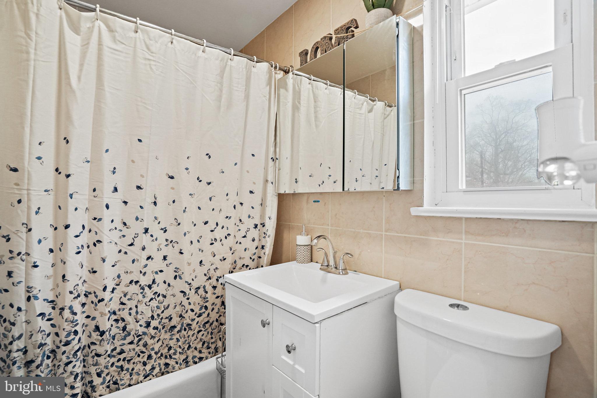 3816 Kayson Street Silver Spring, MD 20906 - Photo 24 of 44 a bathroom with a sink toilet and shower