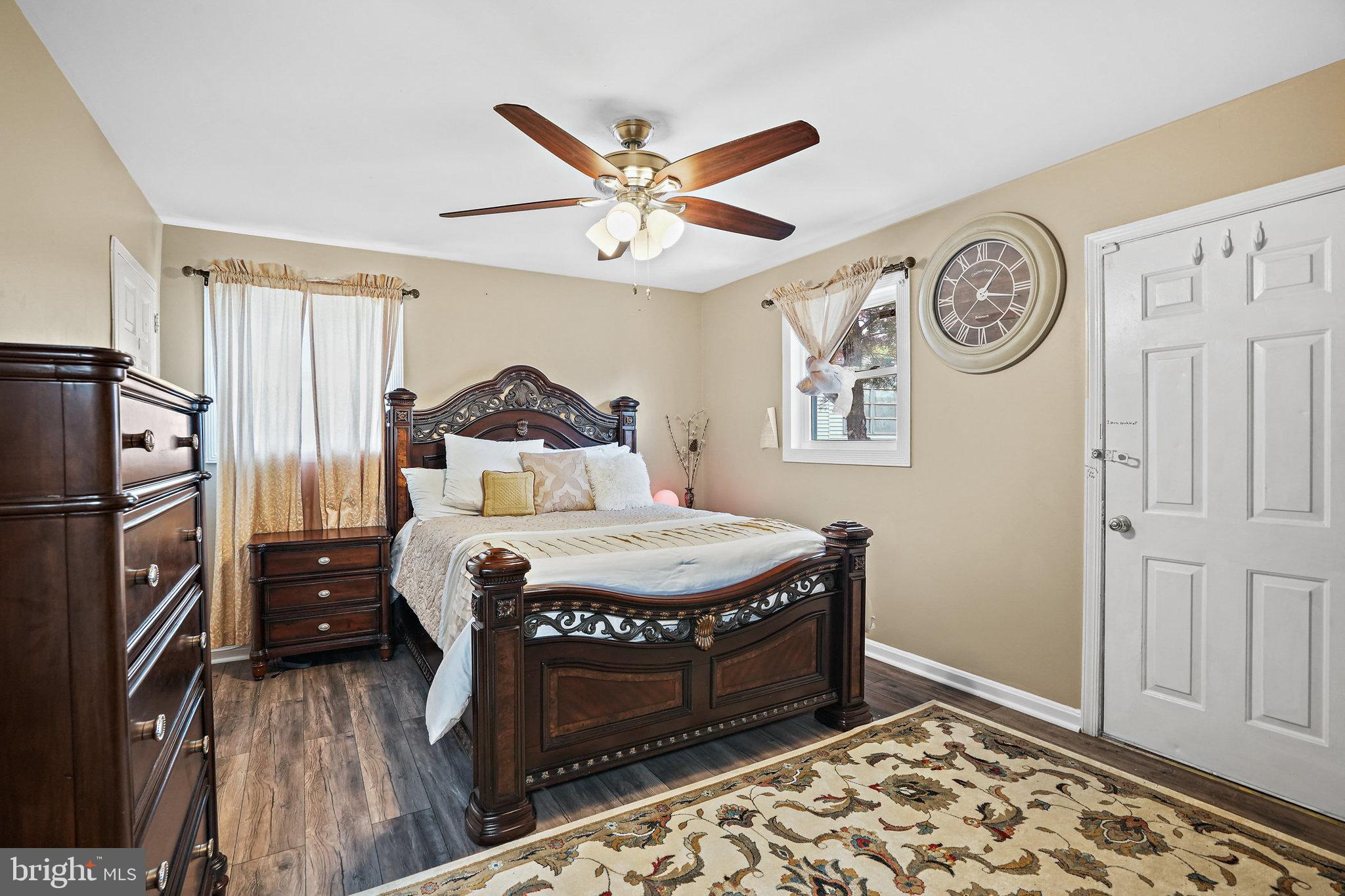 3816 Kayson Street Silver Spring, MD 20906 - Photo 26 of 44 a bedroom with a bed and a chandelier