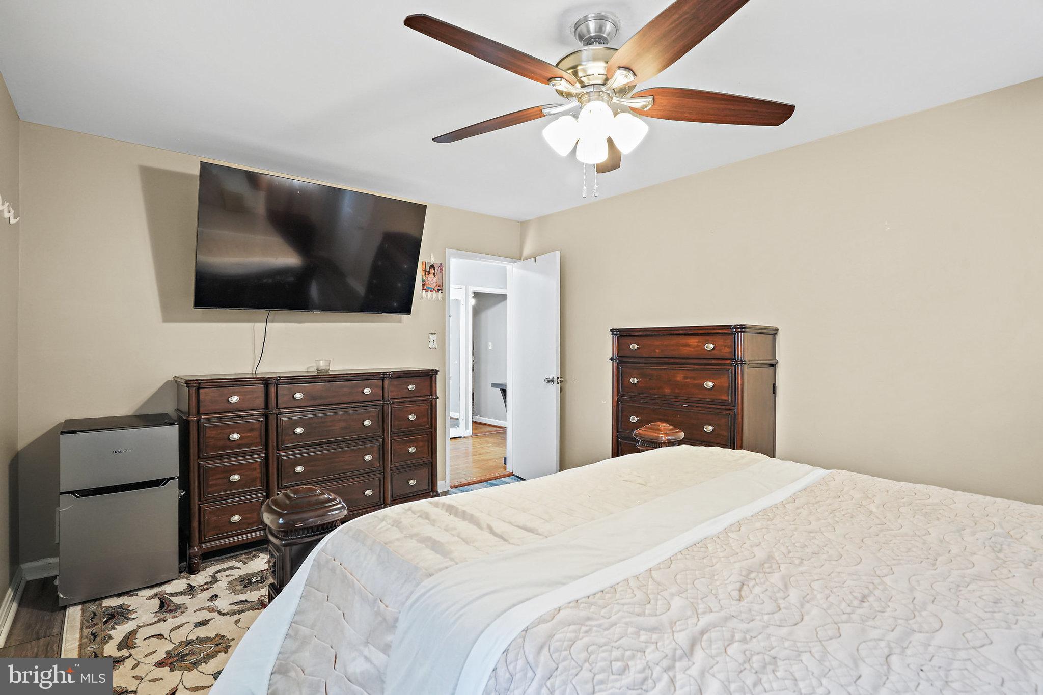 3816 Kayson Street Silver Spring, MD 20906 - Photo 27 of 44 a bedroom with a bed and a flat screen tv