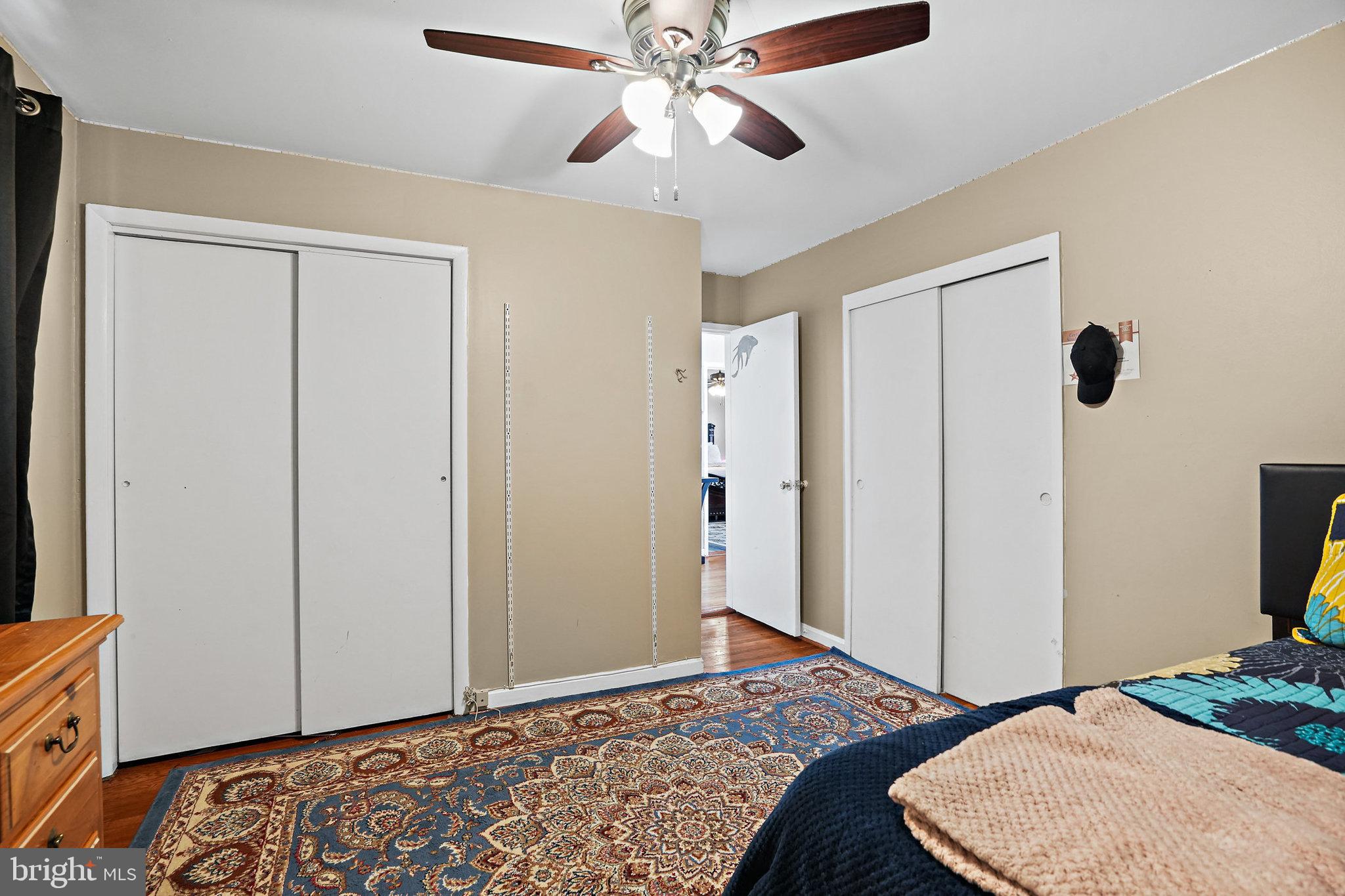 3816 Kayson Street Silver Spring, MD 20906 - Photo 29 of 44 a bedroom with a bed and a flat tv screen on dresser