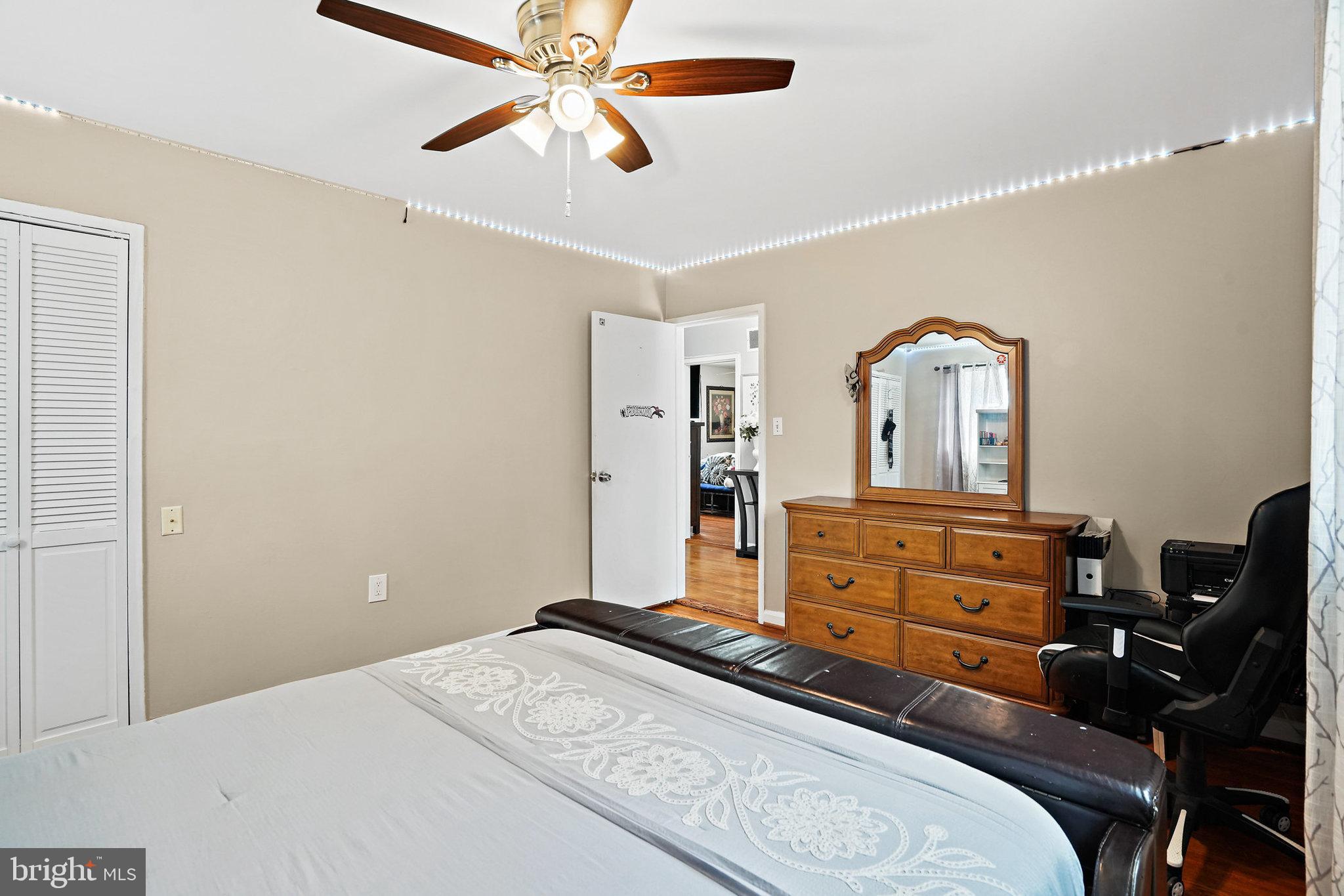 3816 Kayson Street Silver Spring, MD 20906 - Photo 31 of 44 a bedroom with a bed and furniture