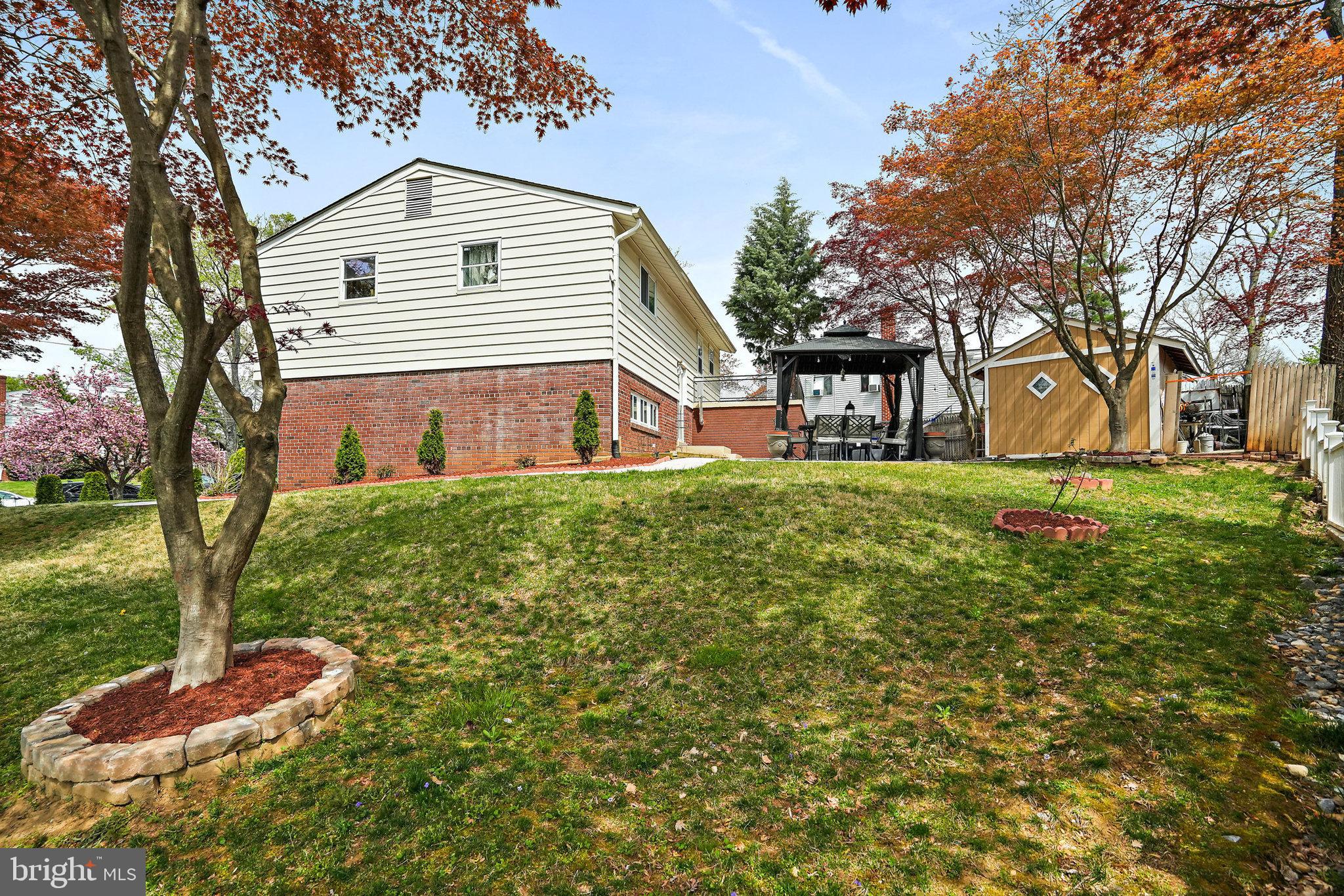 3816 Kayson Street Silver Spring, MD 20906 - Photo 43 of 44 a front view of a house with a yard