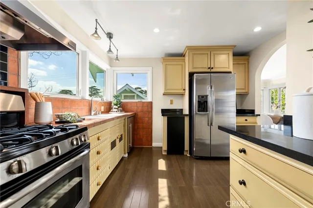 a bedroom with a large bed and a large window
