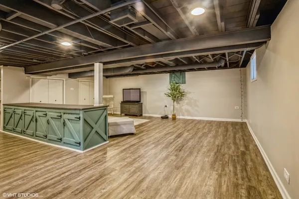 a view of a room with wooden floor