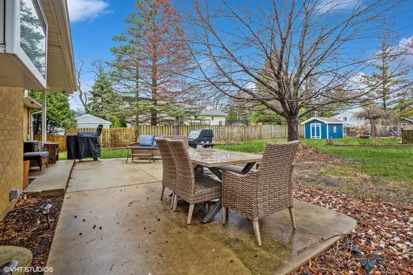 a view of a patio with a yard