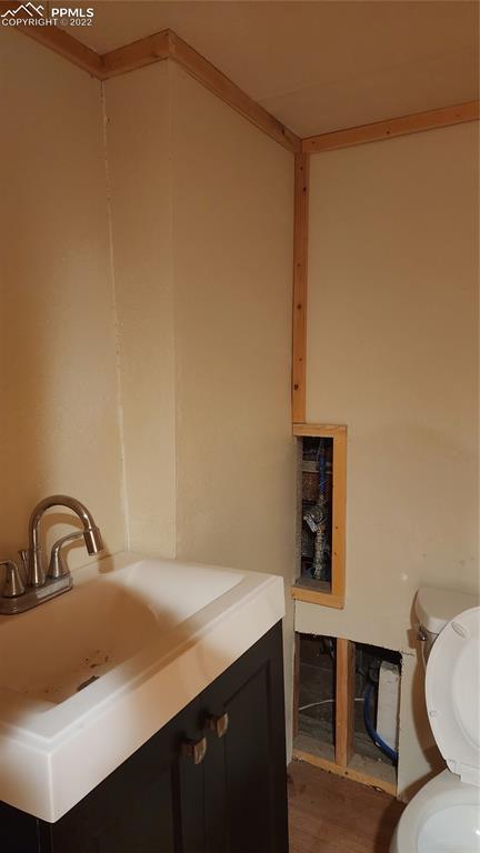 210 7th Street Victor, CO 80860 - Photo 24 of 24 a bathroom with a sink and a toilet