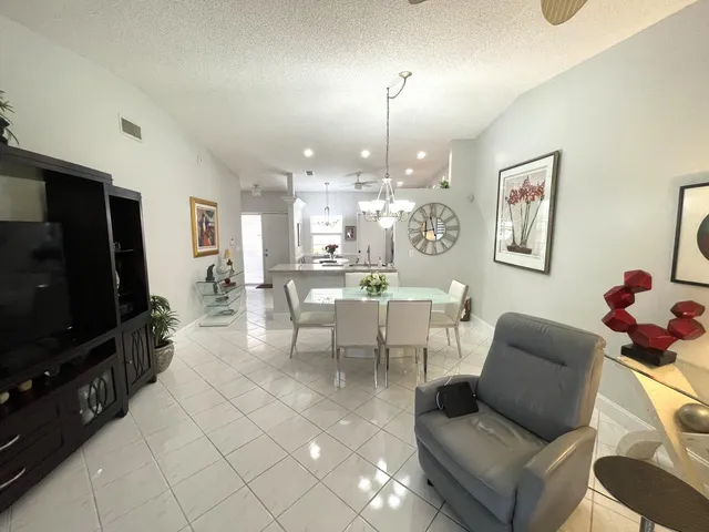 a dining room with a table and chairs