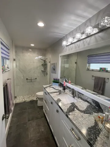 a living room with furniture and flowers