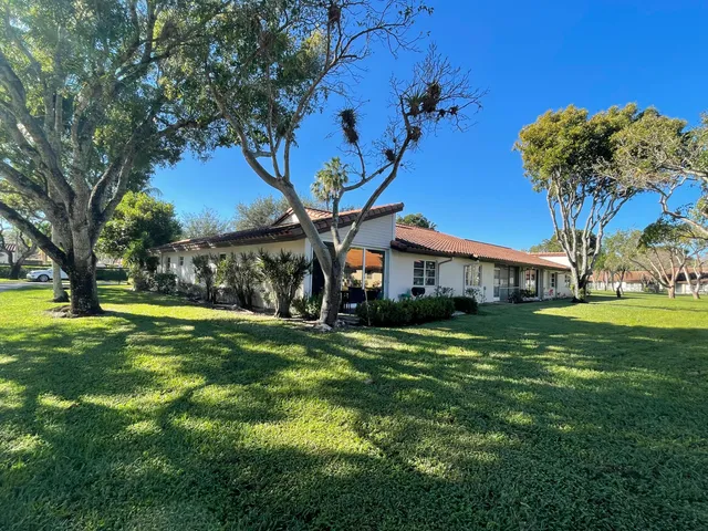 a very nice looking room with a large window and couch