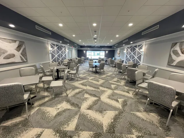 a room with lots of furniture and a chandelier