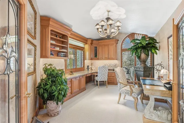 a bedroom with a bed and a table