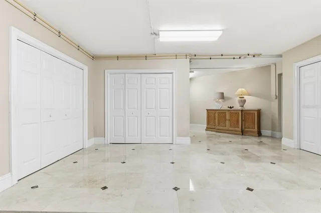 a view of a swimming pool with outdoor seating