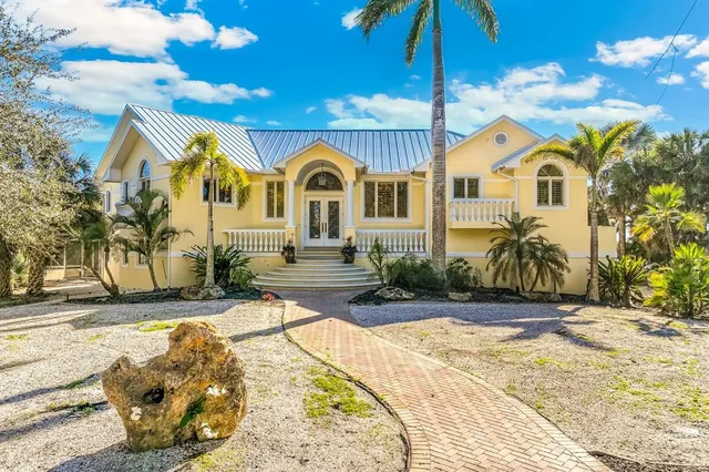 a view of a chairs and table in patio