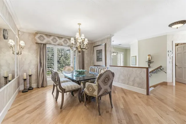 a living room with furniture and large windows