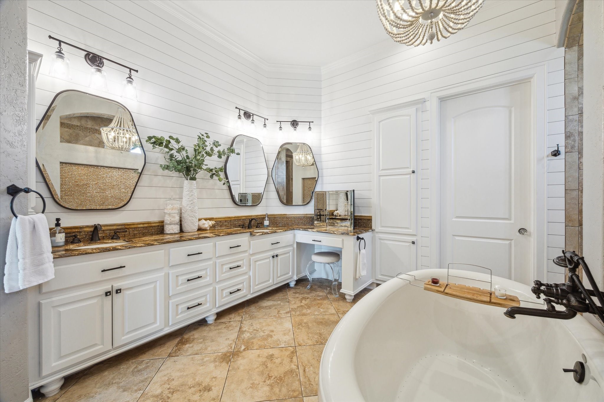 7 Ramrod Hitchcock, TX 77563 - Photo 16 of 41 a spacious bathroom with a double vanity sink a mirror and a bathtub