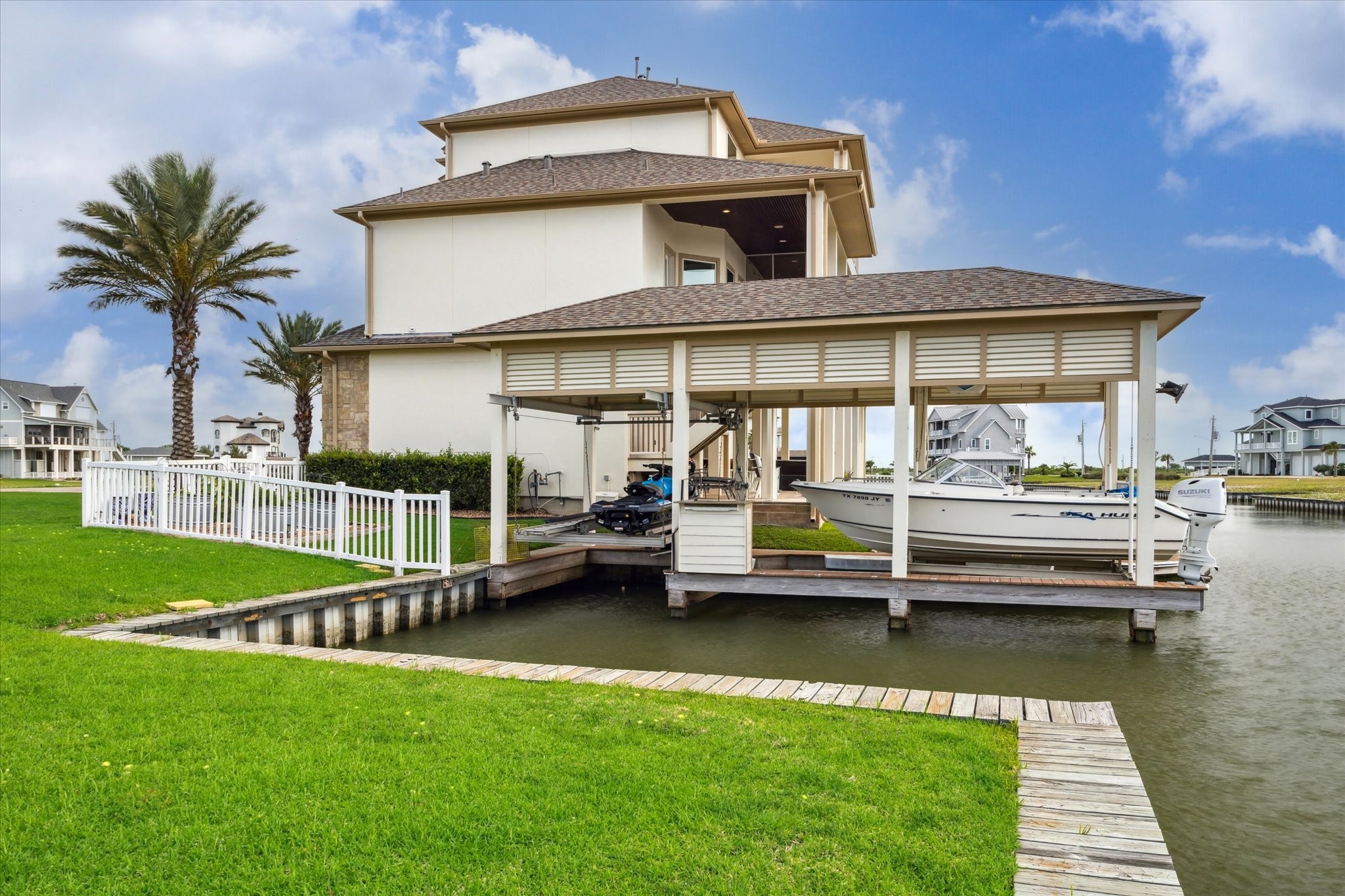 7 Ramrod Hitchcock, TX 77563 - Photo 32 of 41 a front view of a house with a garden and lake view