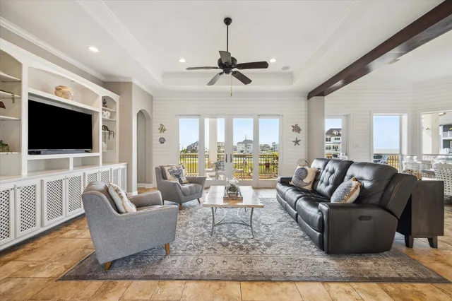 a living room with fireplace furniture and a flat screen tv