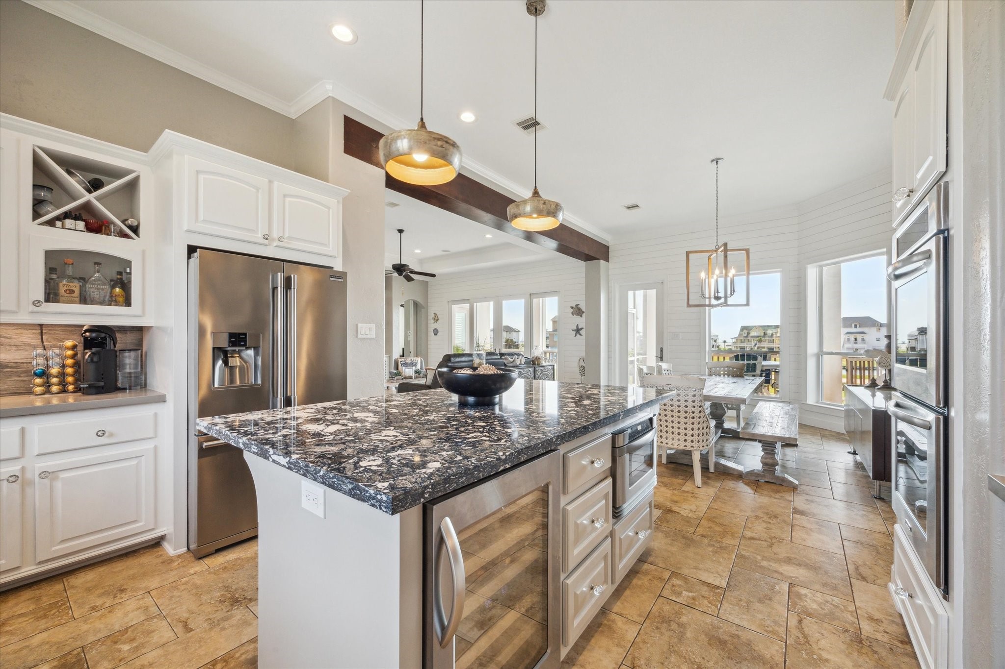 7 Ramrod Hitchcock, TX 77563 - Photo 10 of 41 a large kitchen with kitchen island a large counter top space a sink stainless steel appliances and cabinets