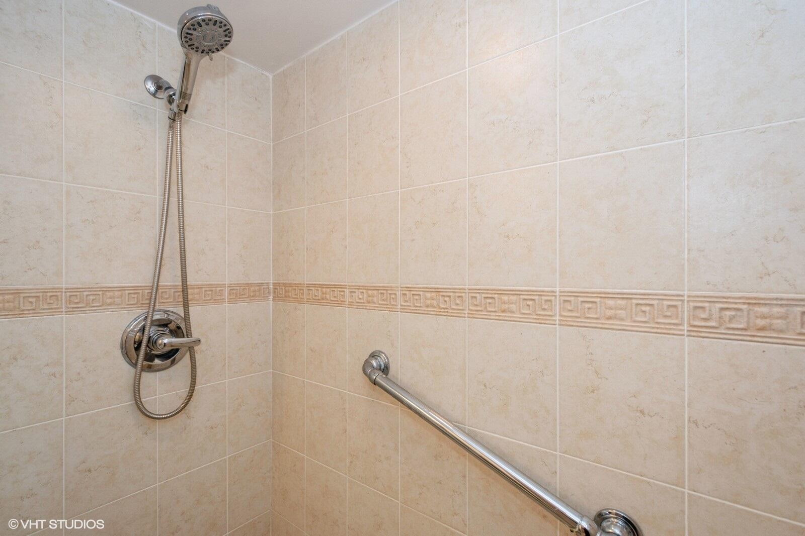 10777 West Sample Road, Unit 101 Coral Springs, FL 33065 - Photo 27 of 36 a bathroom with a shower