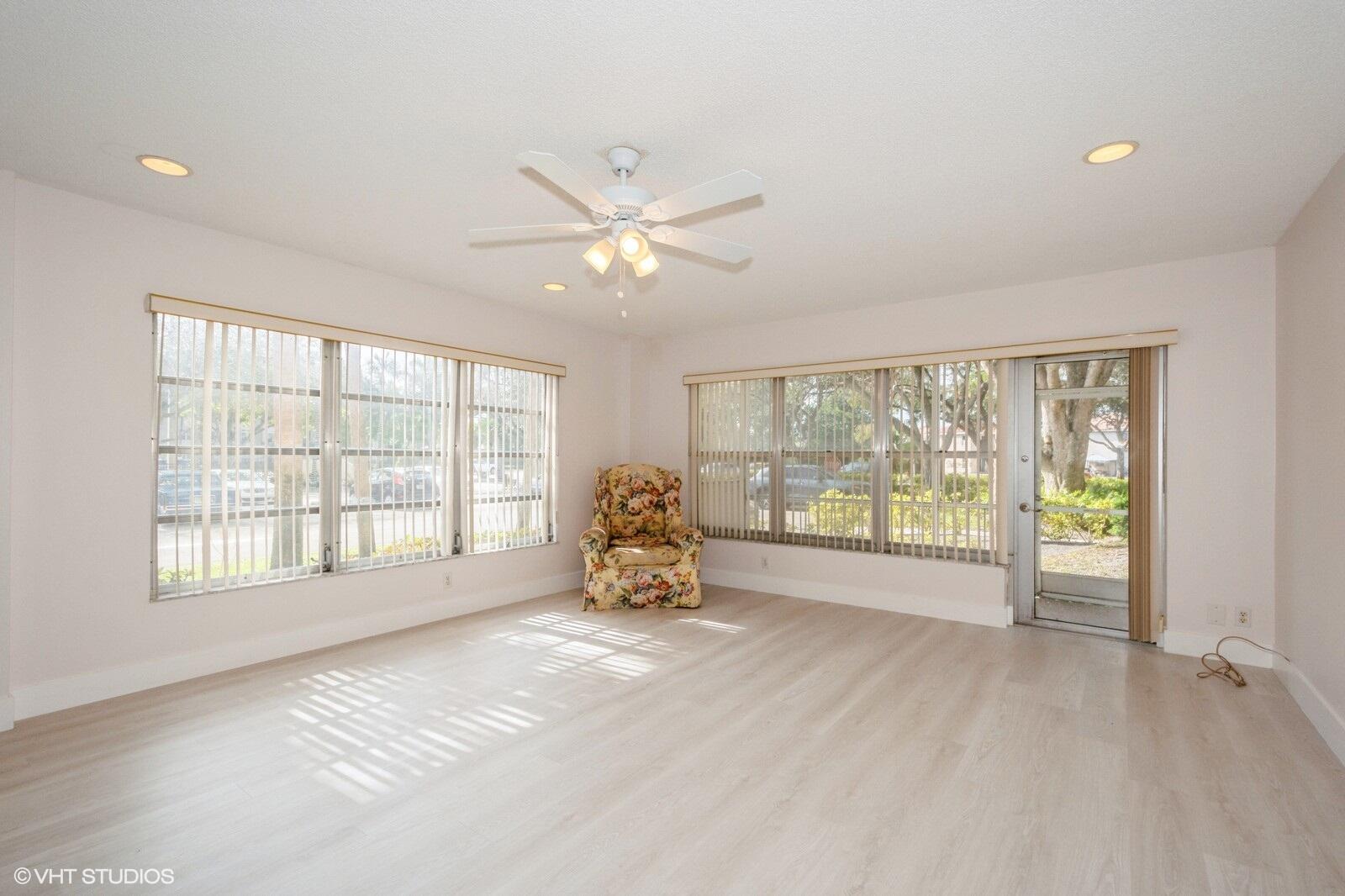 10777 West Sample Road, Unit 101 Coral Springs, FL 33065 - Photo 8 of 36 a view of an empty room with a window