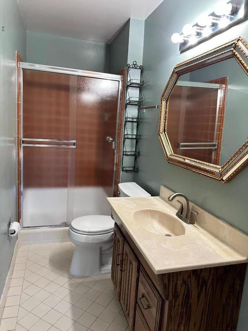 46 Arch Lane San Carlos, CA 94070 - Photo 14 of 22 a bathroom with a sink a toilet and mirror