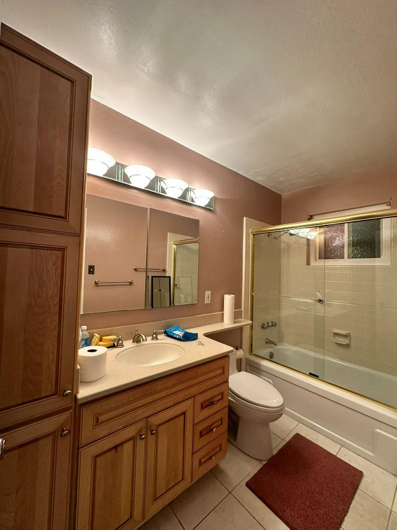 46 Arch Lane San Carlos, CA 94070 - Photo 18 of 22 a bathroom with a sink a toilet and shower