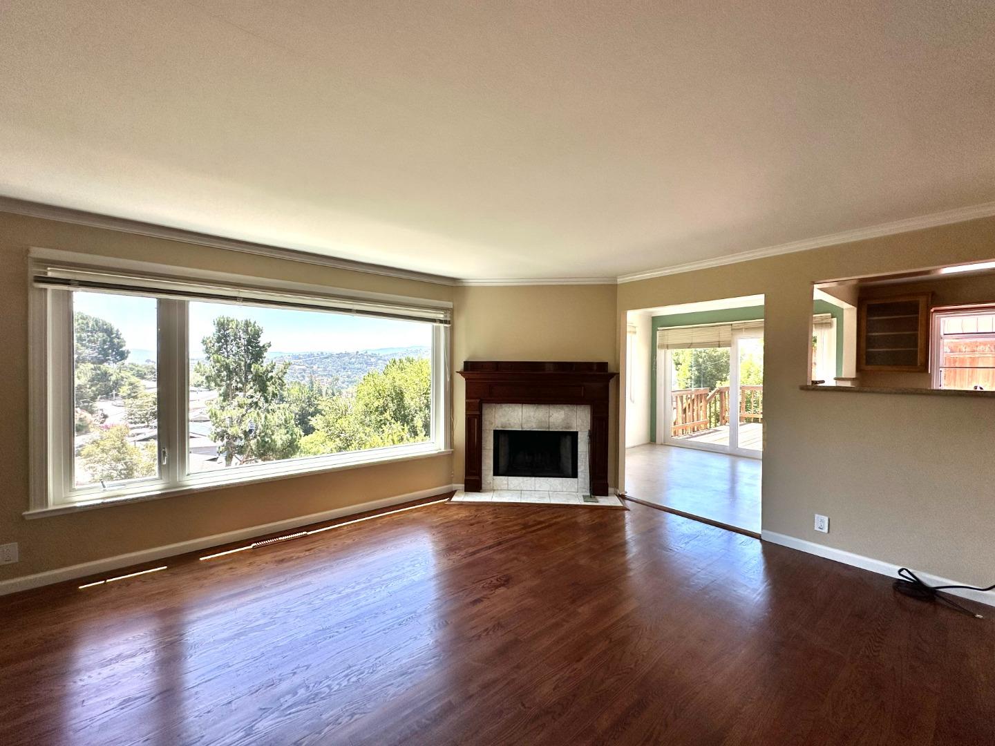 46 Arch Lane San Carlos, CA 94070 - Photo 4 of 22 a view of an empty room with wooden floor and a window