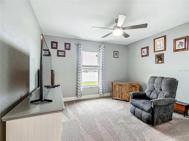 a living room with furniture and a window