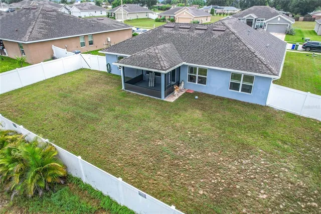 an aerial view of a house with a garden