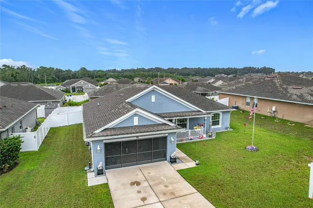 a aerial view of a house with a big yard