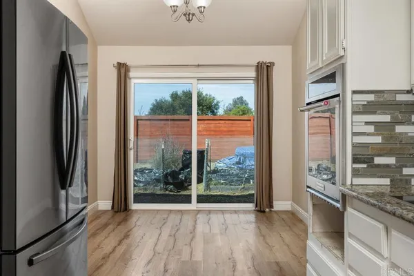 a view of a kitchen with a large window