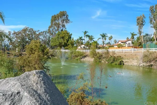 a view of a lake with a yard