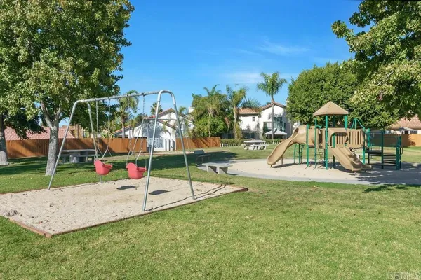 an view of a park with swings