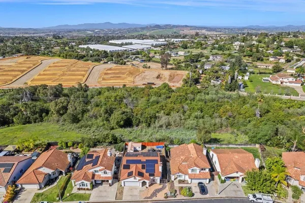 an aerial view of residential houses and outdoor space