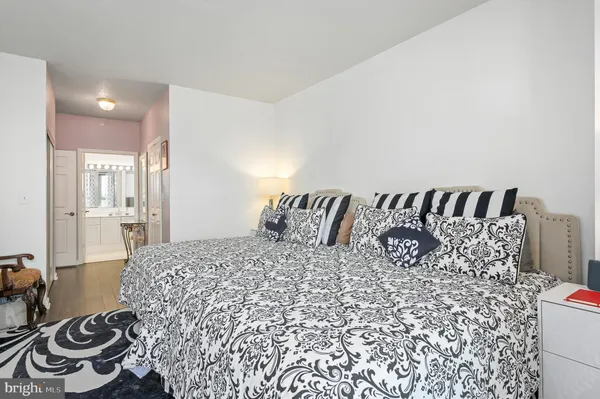 a large white bed in a white room