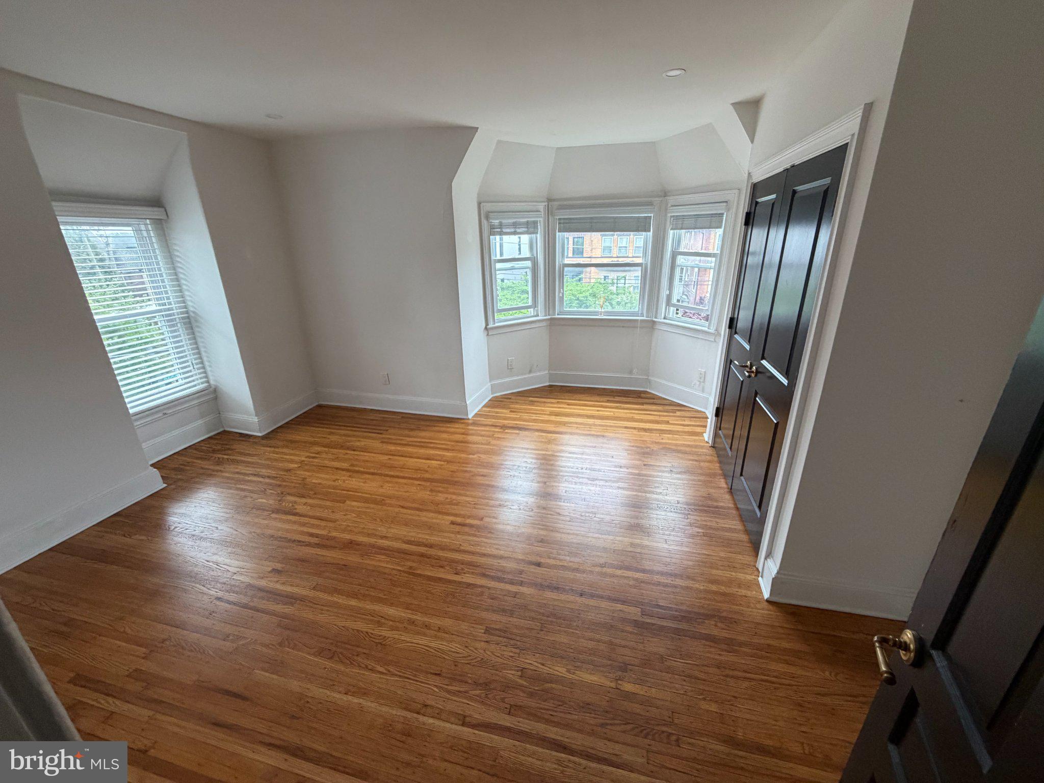 815 South 49th Street Philadelphia, PA 19143 - Photo 47 of 72 a view of livingroom with hardwood floor and window