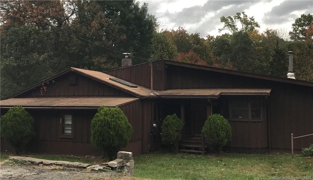 44 Ojibwa Road Shelton, CT 06484 - Photo 1 of 1 a view of a small house with roof and a yard