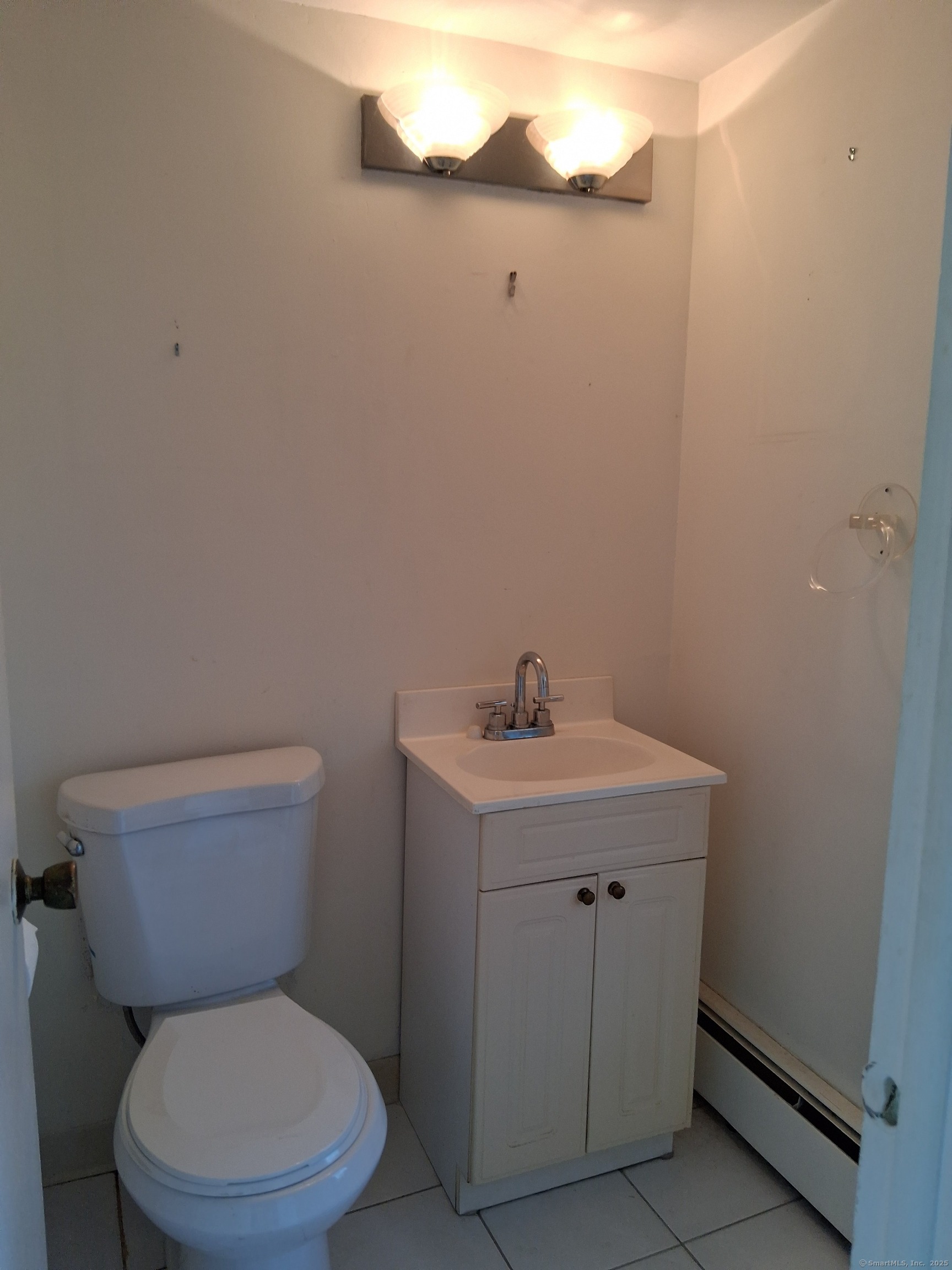 147 Centerbrook Road Hamden, CT 06518 - Photo 6 of 9 a white toilet sitting next to a bathroom sink