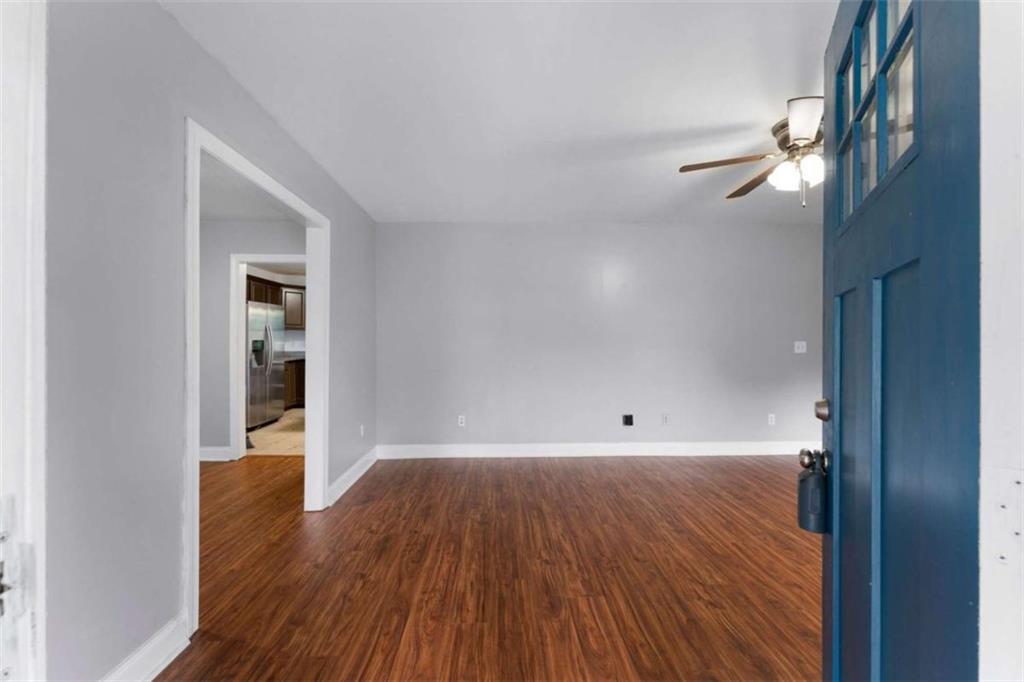 159 Moores Ferry Road Southwest Plainville, GA 30733 - Photo 14 of 43 a view of empty room with wooden floor