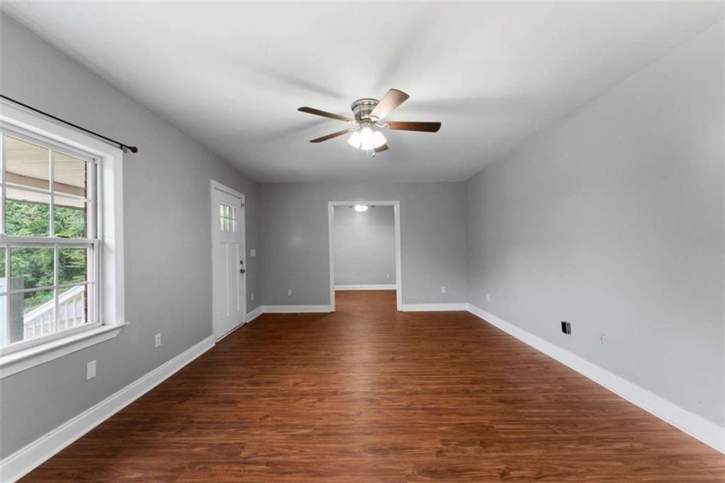 159 Moores Ferry Road Southwest Plainville, GA 30733 - Photo 17 of 43 a view of an empty room with window and a chandelier fan
