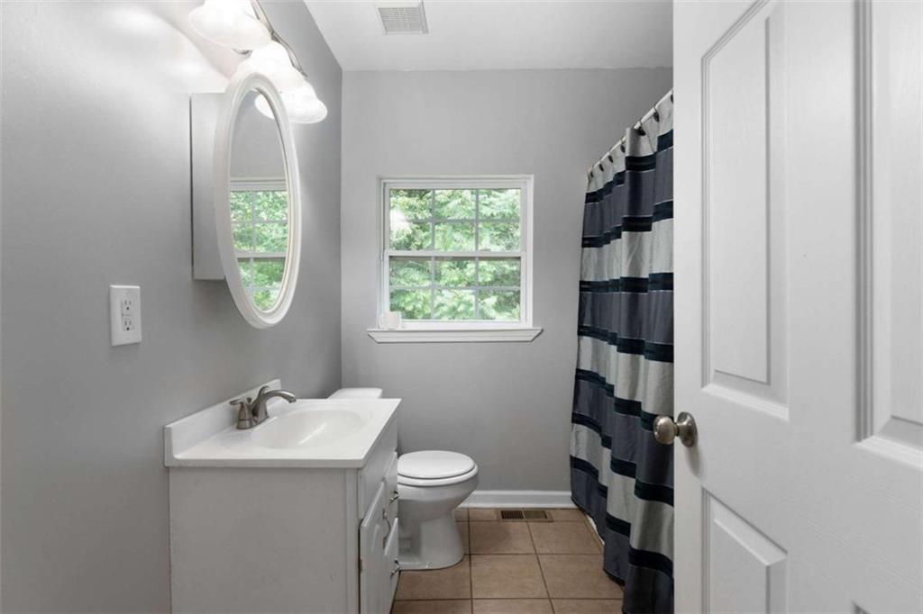 159 Moores Ferry Road Southwest Plainville, GA 30733 - Photo 27 of 43 a bathroom with a sink a toilet and window
