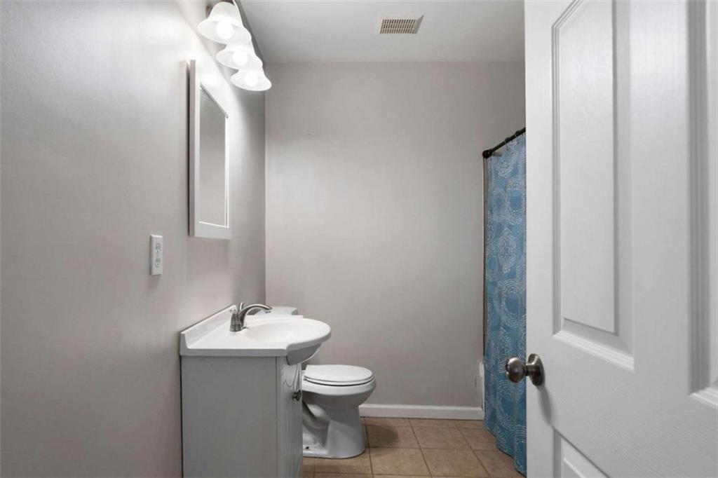 159 Moores Ferry Road Southwest Plainville, GA 30733 - Photo 30 of 43 a bathroom with a toilet sink and mirror